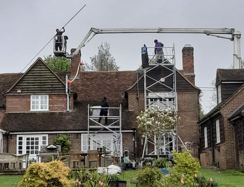 The Roof Moss Cleaners using cherry picker and scaffolding to clean roof safely and professionally in Corsham, Wiltshire