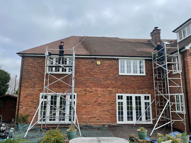 Roof cleaning carried out safely from scaffold towers by The Roof Moss Cleaners in Corsham